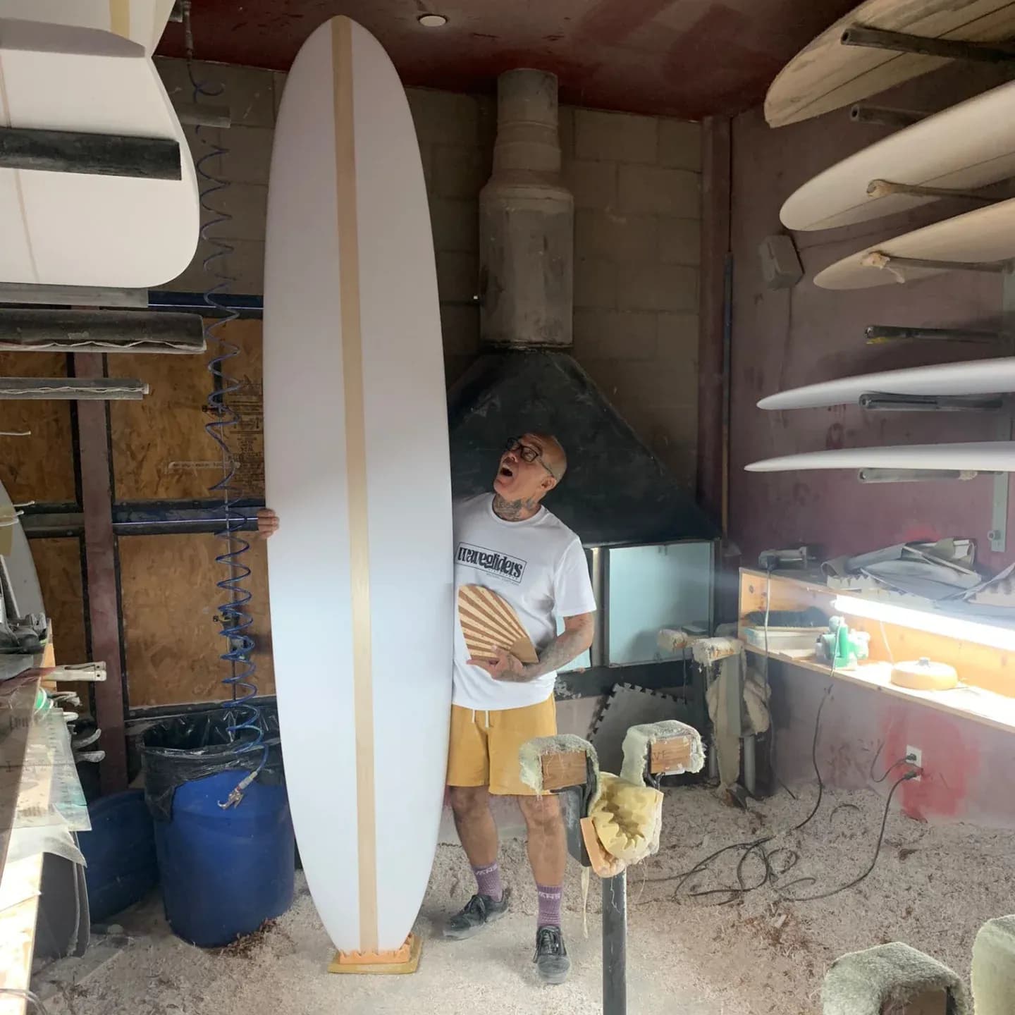 nico posing with surfboard